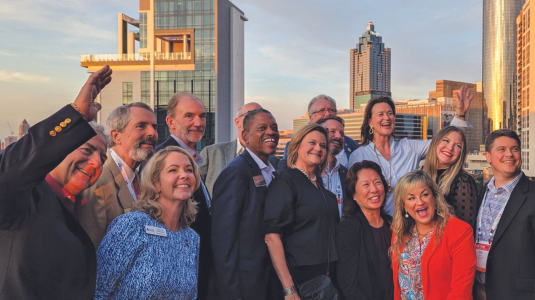 A group of CCIMs posing in front of the Seattle Skyline in October 2023.