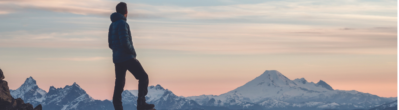 Man on a cliff contemplating his next steps